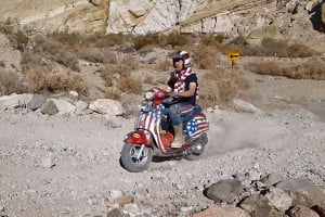scooter goes up hill climb with knobby tires